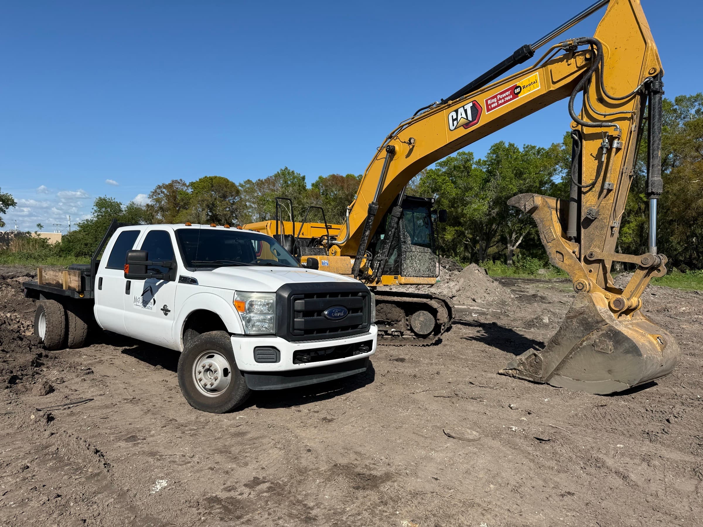 Mojo Demolition and Excavation equipment on a coastal Tampa Bay debris removal project